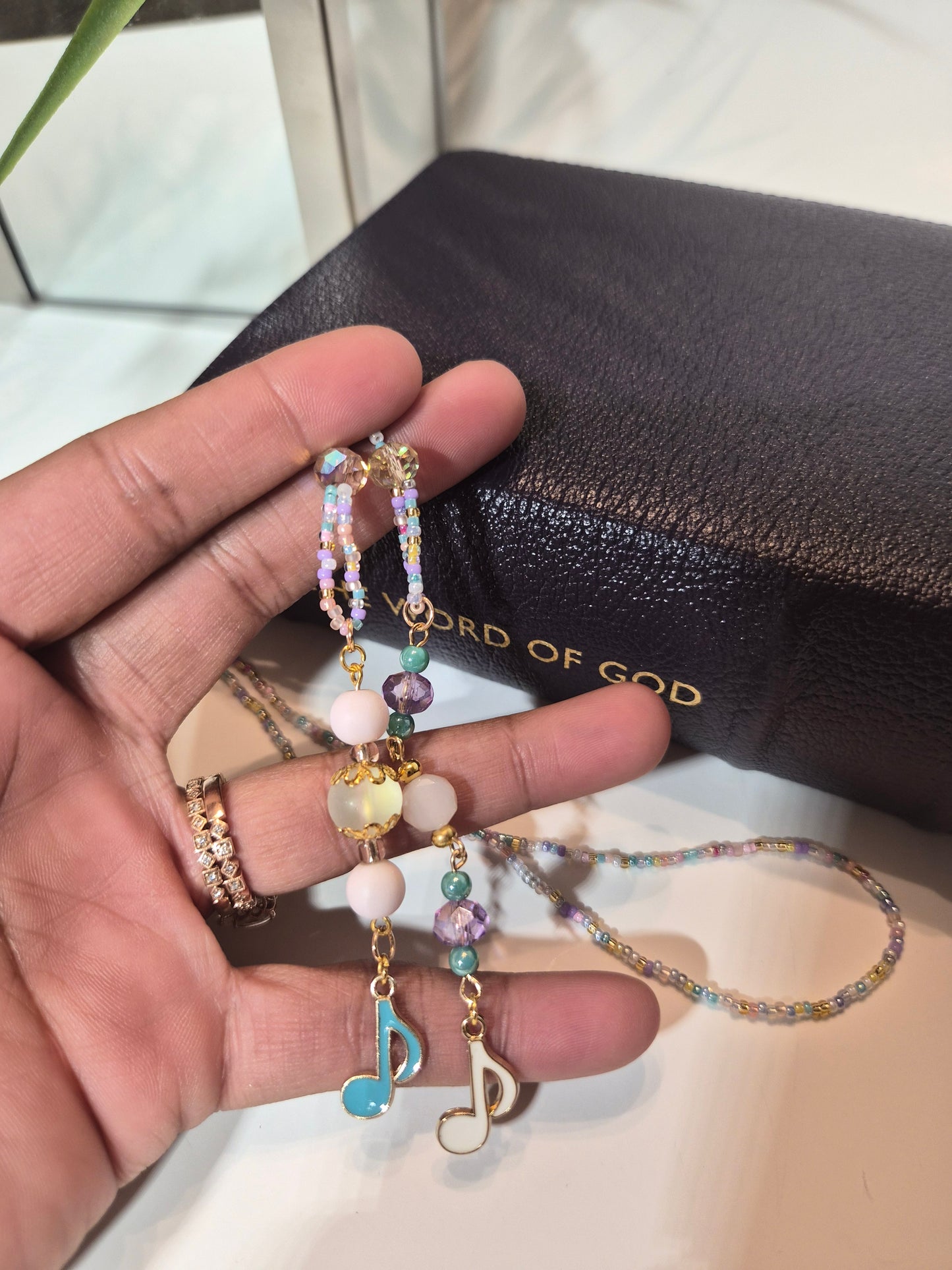 Faith Mixtape Beaded Bookmark - marking a page in an open Bible - Faith Focused Lifestyle